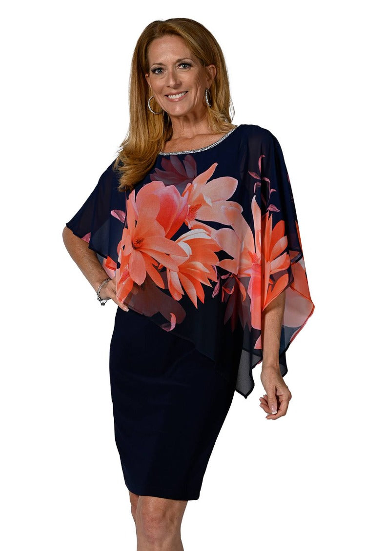 Frank Lyman Floral Overlay Dress Style: 238348 This luxurious dress features a beautiful harmony of navy silky jersey and coral floral overlay trimmed with glimmering rhinestones. Crafted from 95% polyester and 5% elastane, this elegant piece is sure to make a statement at any event. For best fit please refer to this size guide,