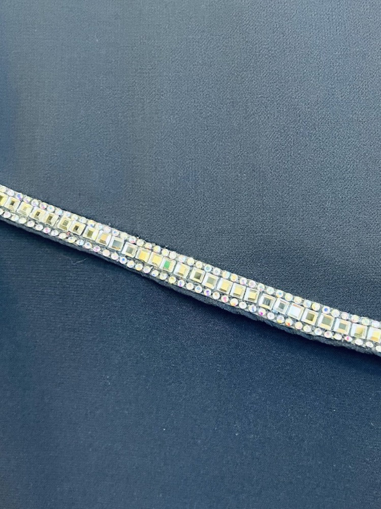 Frank Lyman Crystal Overlay Dress Add a little sparkle to your closet with this Frank Lyman Crystal Overlay Dress! This pretty piece features a classic v-neckline, asymmetrical overlay and intricate crystal trim. Perfect for an intimate party or wedding! Proudly made in Canada.