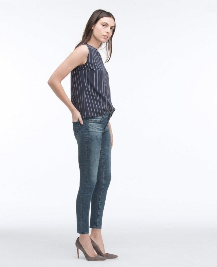 AG Medium Wash Ankle Legging Style # PVC1389 Signature skinny, cropped ankle length Soft Japanese denim with power stretch and astounding recovery Mid blue jean has subtle whiskering and the hips and faded through the knee and set to emulate the look of natural wear Classic five pocket design Zip fly and single button closure