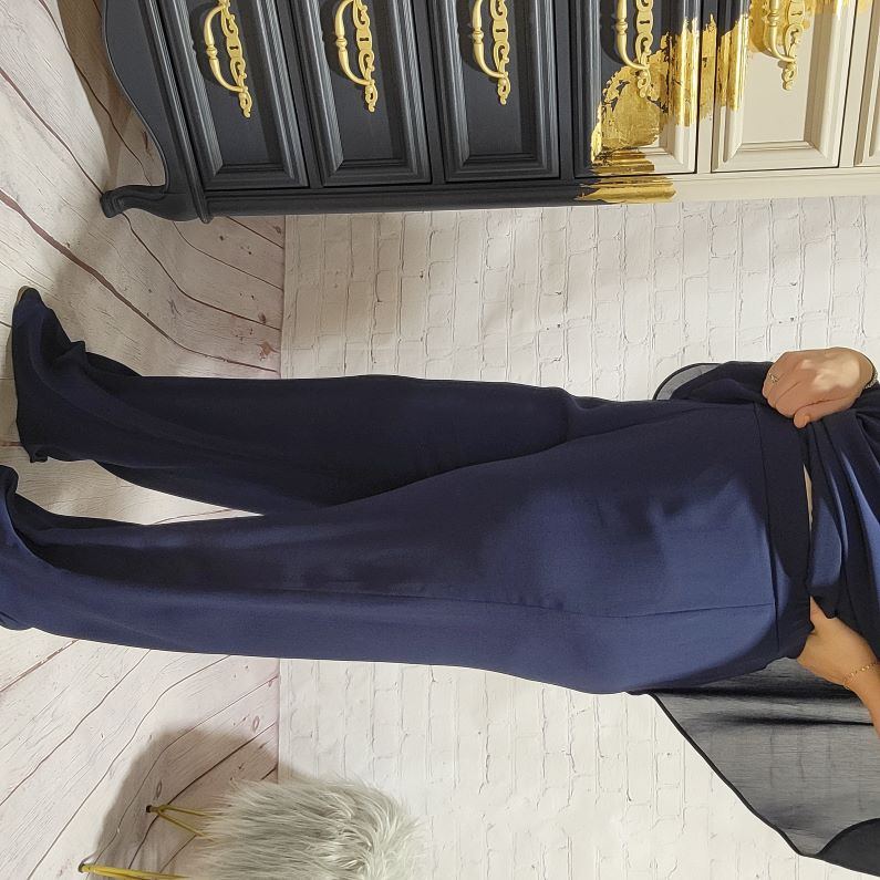 For the lovely ladies who want a pant for special occasions. These elegant Wide Leg Pants from Frank Lyman are a perfect compliment to your style. They give you a comfortable all day wear with the loose chiffon overlay adding just the right amount of dimension.