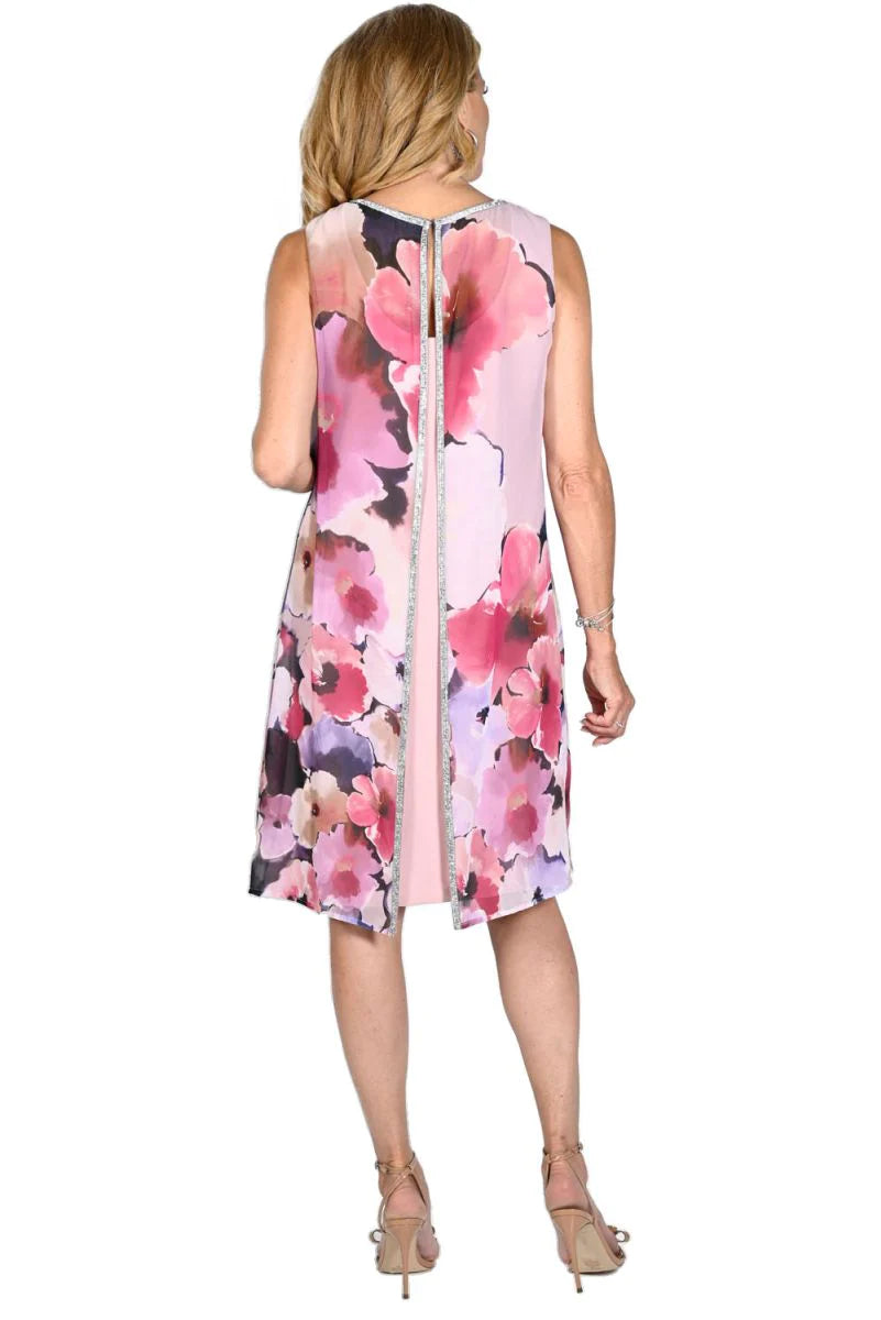 This beautiful Frank Lyman Dress is a sure to please choice for any occasion. The floral print overlay moves with you and has a sparkling rhinestone detail along the split back. You will love the way it feels and looks as you dance the night away.