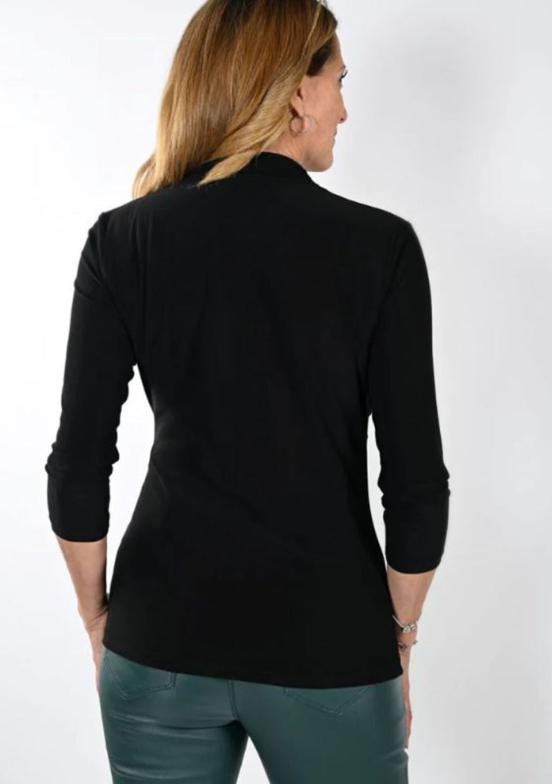 Frank Lyman brings you this beautiful crossover, wrap style top with 3/4 sleeves that fits into your everyday wardrobe. Wear it alone or with a bright blazer for days in the office or pair it with a jean for a more casual look. Any way you wear it you can be sure of having comfort and style.