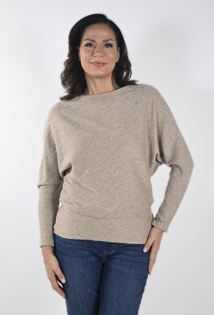 This Frank Lyman top features batwing sleeves that gracefully hug the forearms, for an elegant pairing of comfort and style. Its unique texture exhibits a matte finish, with a visual texture through its wavy lines. Additionally, the waist and hips are fitted, outlining your silhouette.
