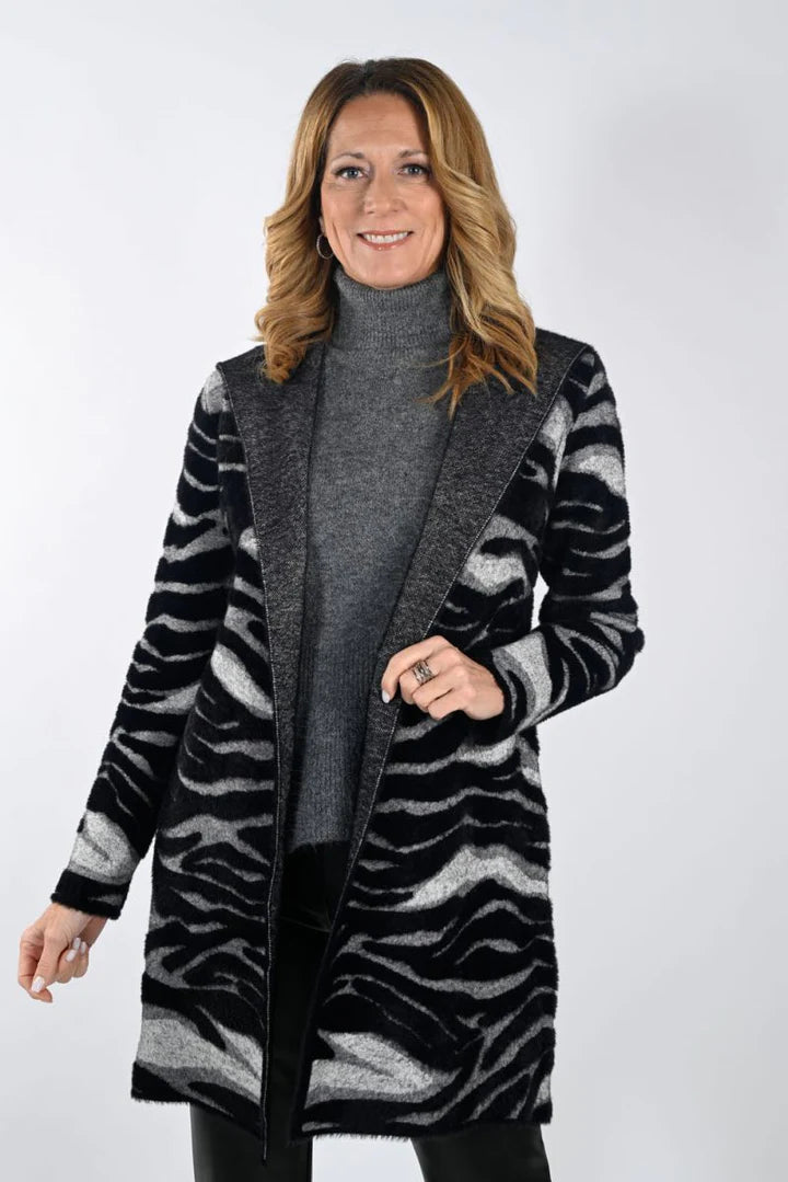 Cardigans are a perfect blend of comfort and style and the Zebra Print Hooded Cardigan from Frank Lyman gives you all that and more. The beautiful print is a perfect choice to finish off both casual and classic looks.