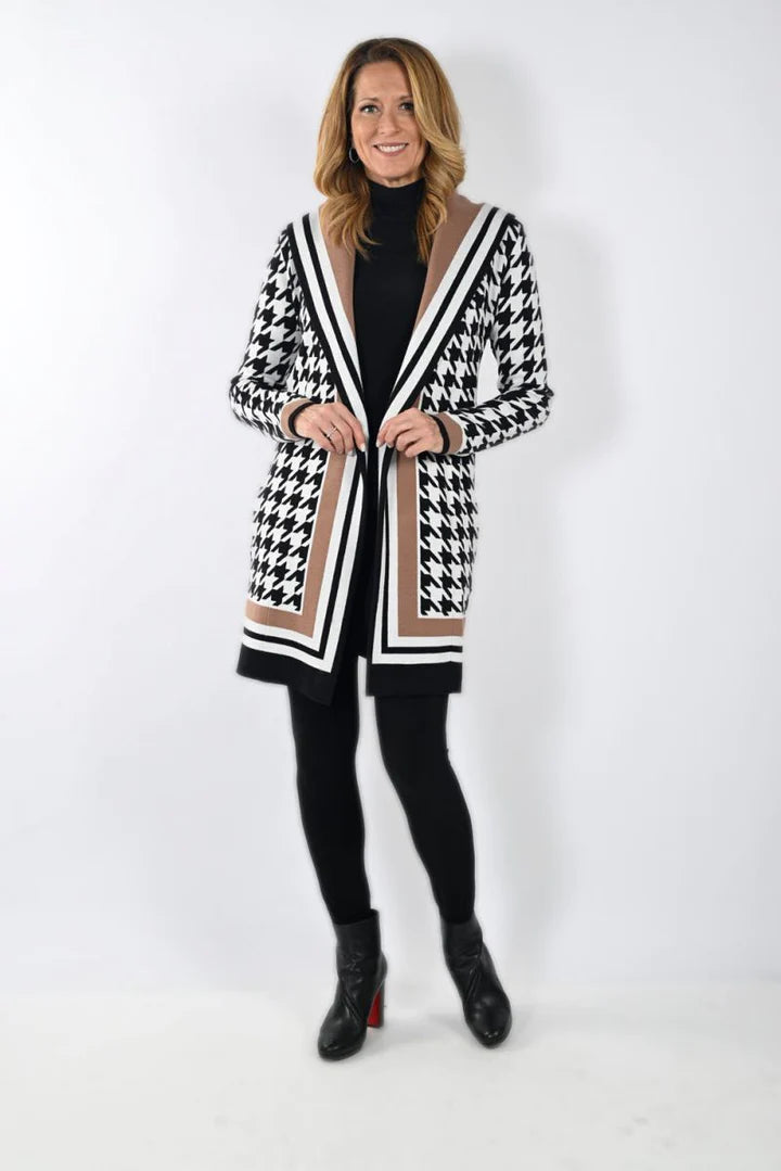 Give yourself the feeling of being both chic and bold in the Frank Lyman Houndstooth Hooded Cardigan. The large houndstooth print capped off with thick, bold stripes is the perfect combination of drama and style to top off your outfit for any day. 