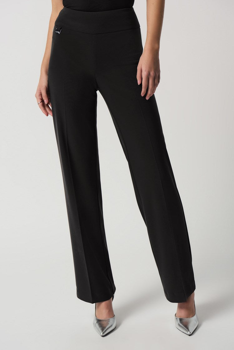 Add the Joseph Ribkoff Wide-Leg Pull-On Pants to your wardrobe, and you'll have a go-to style for any occasion. This bonded silky knit material is highly sought after and perfect for creating various looks. The wide-leg silhouette is flattering on any figure, while the contoured waistband provides a comfortable, tailored fit. 