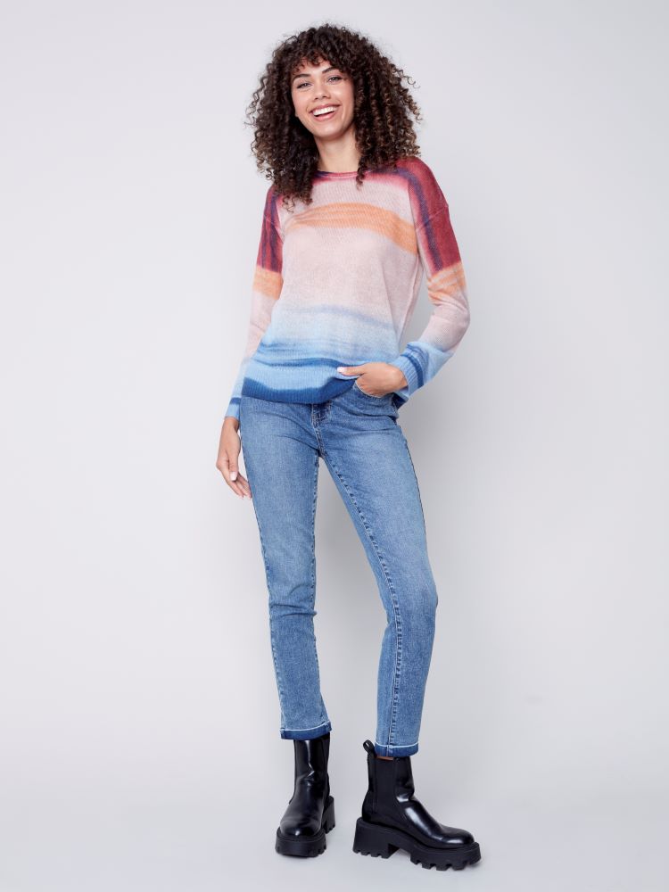 Stay cool and collected in unpredictable seasonal temps with this Tie Dye Sheer Knit Sweater from Charlie B featuring a classic crew neckline.  The various hues in this beautiful sweater add visual interest to your outfit and turn this top into a winner with pretty much any solid-colored pair of pants or jeans. 