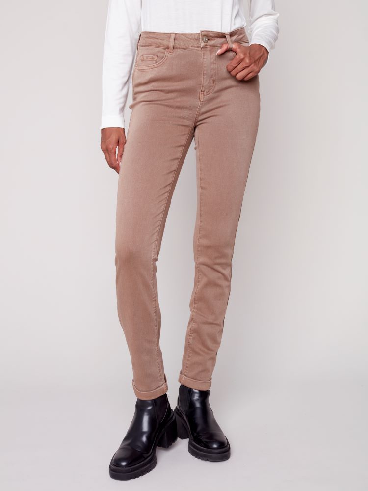 These Cuffed Hem Jeans in Truffle brown from Charlie B have a slim fit and a stretchy denim blend, offering unbeatable comfort and style. Their timeless appeal ensures they are a wardrobe essential; their warm hue and stylish details make them an ideal choice for the season. Paired with a cream turtleneck top and make a chic outfit.