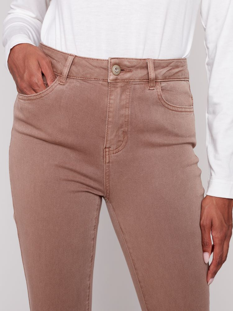 These Cuffed Hem Jeans in Truffle brown from Charlie B have a slim fit and a stretchy denim blend, offering unbeatable comfort and style. Their timeless appeal ensures they are a wardrobe essential; their warm hue and stylish details make them an ideal choice for the season. Paired with a cream turtleneck top and make a chic outfit.