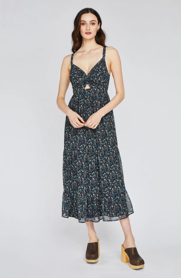 The Kiera dress from Gentle Fawn is made of chiffon with a floral print designed in-house. Features include a twist front with cut-out detail, adjustable straps,  and a lined midi length tiered skirt with back panel smocking for an effortlessly feminine feel. 