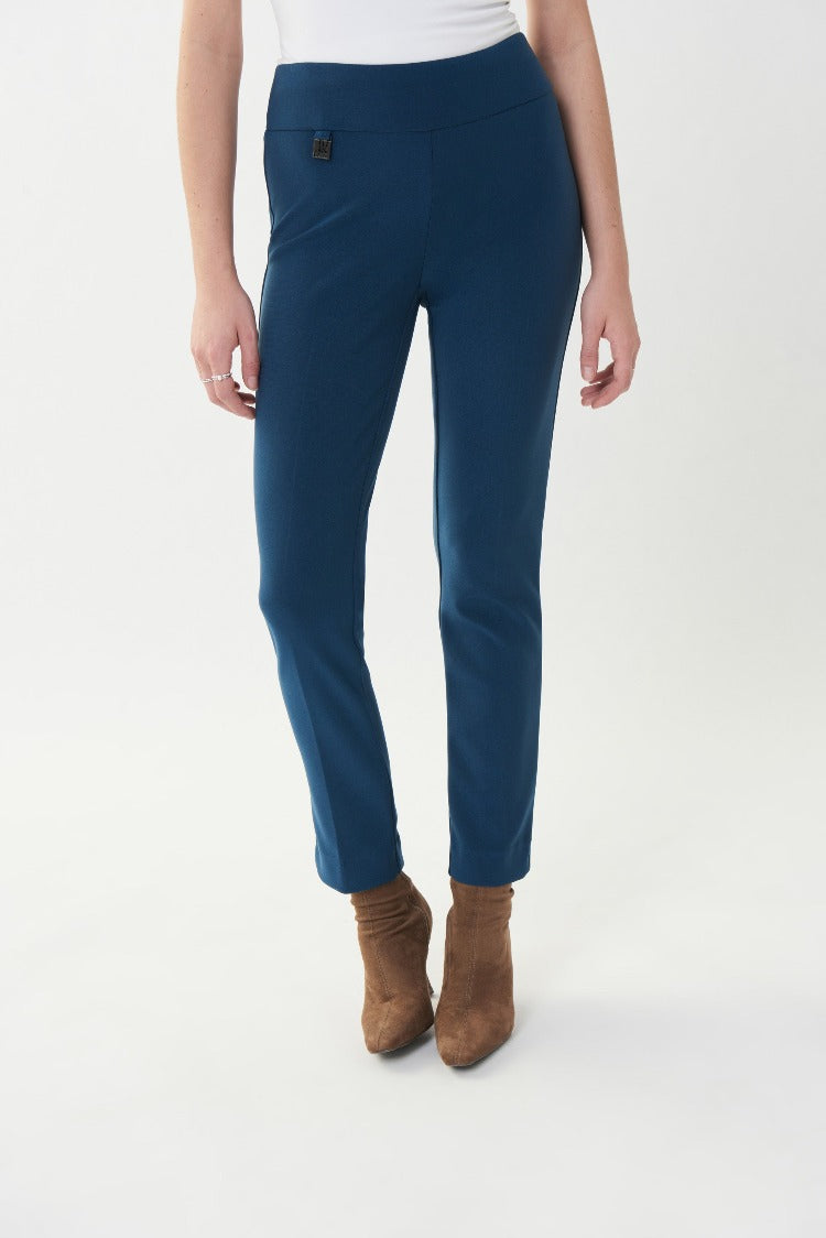 These classic pull on  Joseph Ribkoff Dress Pants are a staple for any professional woman. These pants come in a slim fit with stylish notches at the ankle to showcase your shoes and a signature Joseph Ribkoff metal hip tag. 