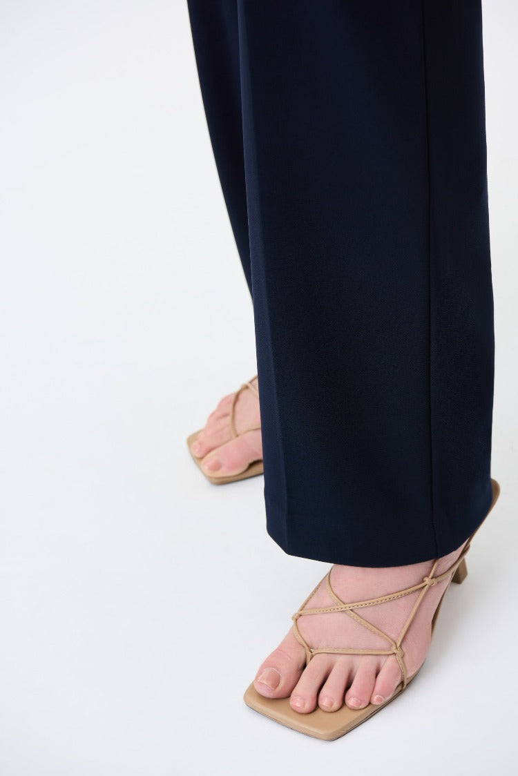 The mid-rise Joseph Ribkoff Pull-on Pant style features a wide, straight-leg, and an elasticized waist. The comfortable fit also gives you a lovely silhouette that will look great with a blouse and even toss on a blazer or cardigan with it.