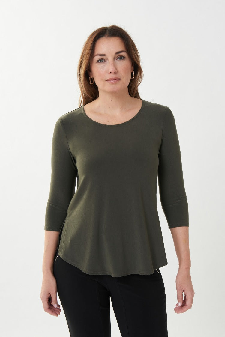 This Joseph Ribkoff Long Sleeve Top is the perfect basic for layering or wearing on its own. It features a round neckline, 3/4 length sleeves and a stylish side slit. Proudly made in Canada.