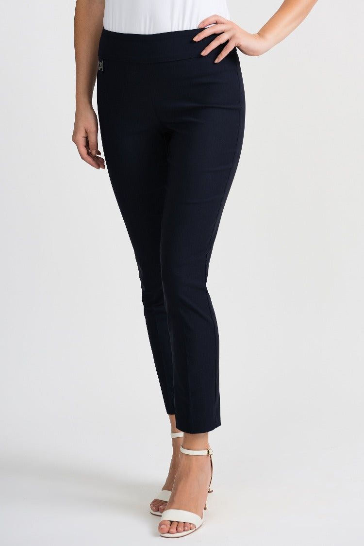These Lydia Crop Pants from Joseph Ribkoff are a sophisticated choice for any occasion. These pants feature a wider waistband, cropped length and a signature Joseph Ribkoff metal detail on the hip. Proudly made in Canada.