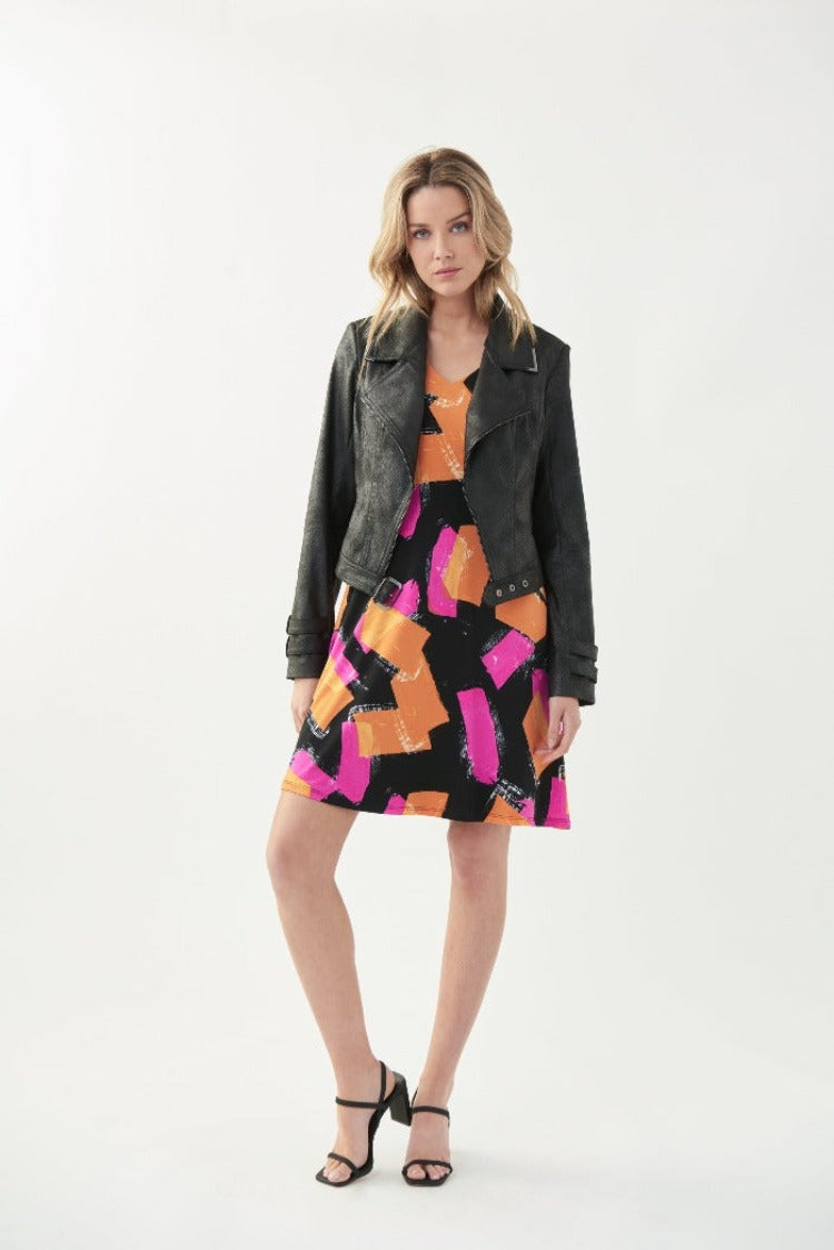 This Joseph Ribkoff Block Print Dress is both comfortable and colourful! This dress features sultry shoulder cutouts, a flirty a-line skirt, and pockets for all of your must-haves. The low-maintenance fabric makes this a great dress for travelling. 