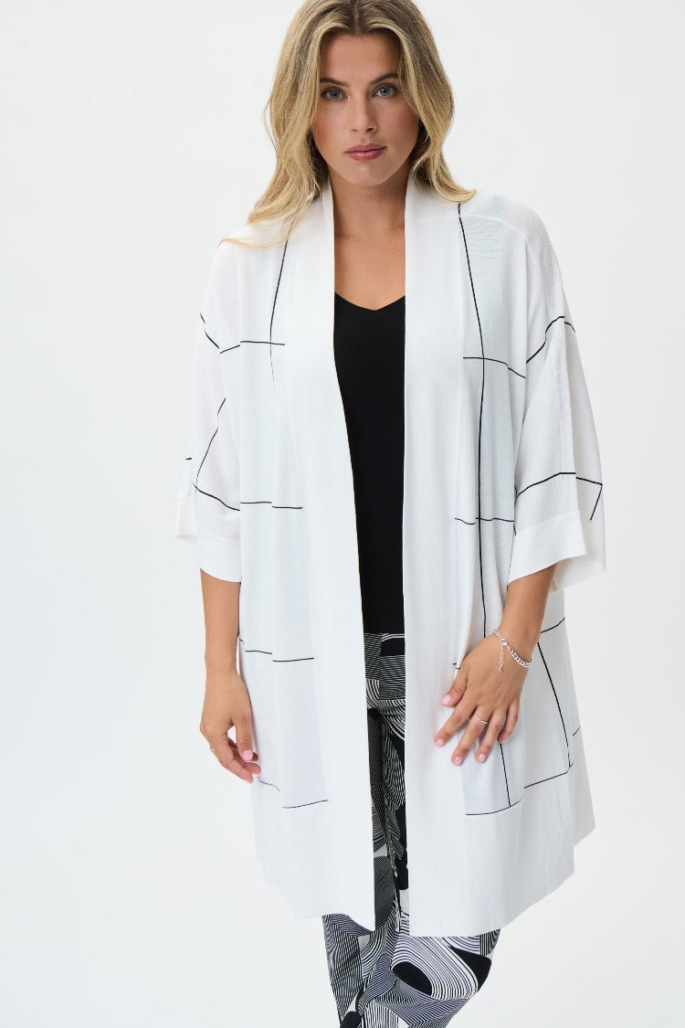 This Joseph Ribkoff Cardigan is a stylish staple for your wardrobe. This relaxed-fit cover up features a subtle, oversized white check pattern with 3/4 sleeves, perfect over a casual or formal outfit. 