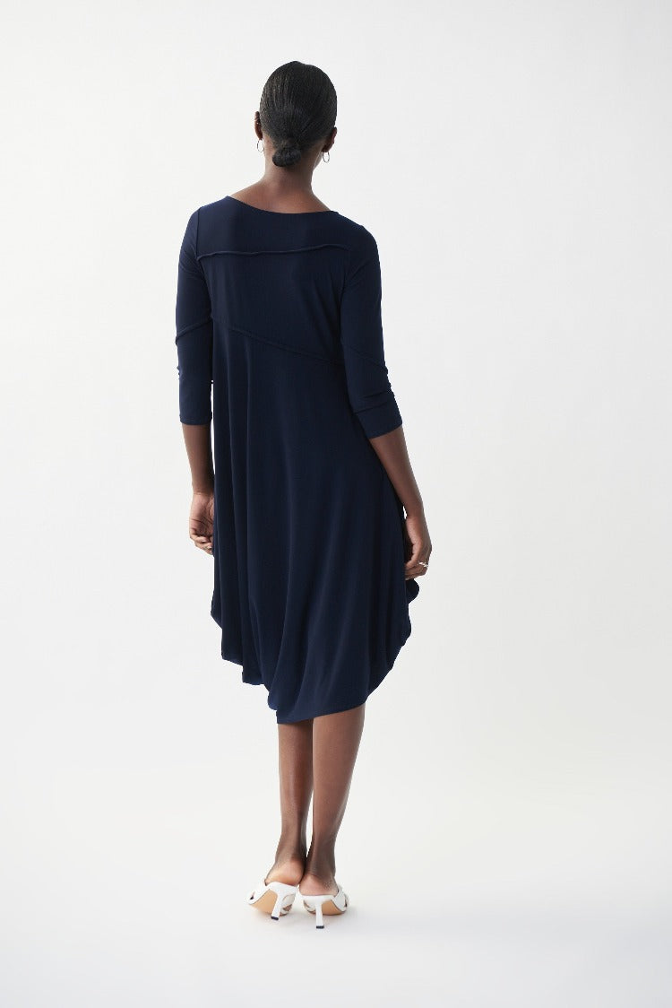 This Joseph Ribkoff Sleeveless Flowy Dress is an easy piece you'll love to wear again and again. With unique stitching on the bodice and arms, convenient 3/4 length sleeves and an angled, bubble-style hemline, this basic is the perfect throw-on dress.