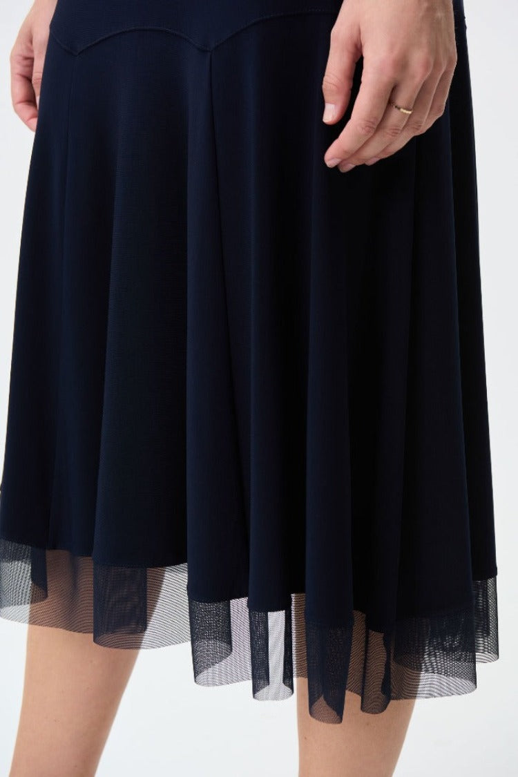 Let your inner child out to play with this Joseph Ribkoff Chiffon Skirt. Its chiffon overlay gives a beautiful flowy movement that you will not want to stop. Perfect to go dancing in, even if it's just down the hall.