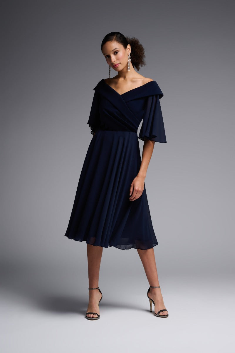 Defined by its flattering, off-shoulder cut, this Joseph Ribkoff dress will add an element of elegance to all your occasions. With the flowing fluttery sleeves and skirt you will feel the romance of this piece and wear it often.
