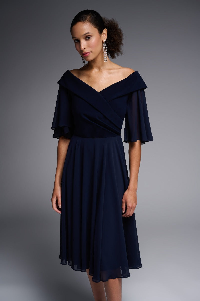 Defined by its flattering, off-shoulder cut, this Joseph Ribkoff dress will add an element of elegance to all your occasions. With the flowing fluttery sleeves and skirt you will feel the romance of this piece and wear it often.