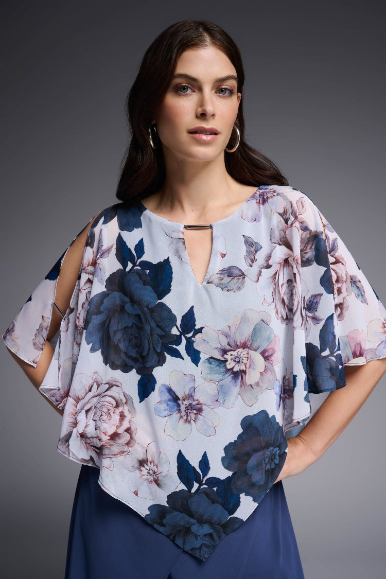 Feel like a walking piece of art in this Joseph Ribkoff Floral Chiffon Poncho Top. Carefully crafted from airy chiffon, cut for a flowing silhouette and decorated with a keyhole neckline makes this top feel as fabulous as it looks. Part the Joseph Ribkoff Signature Collection.