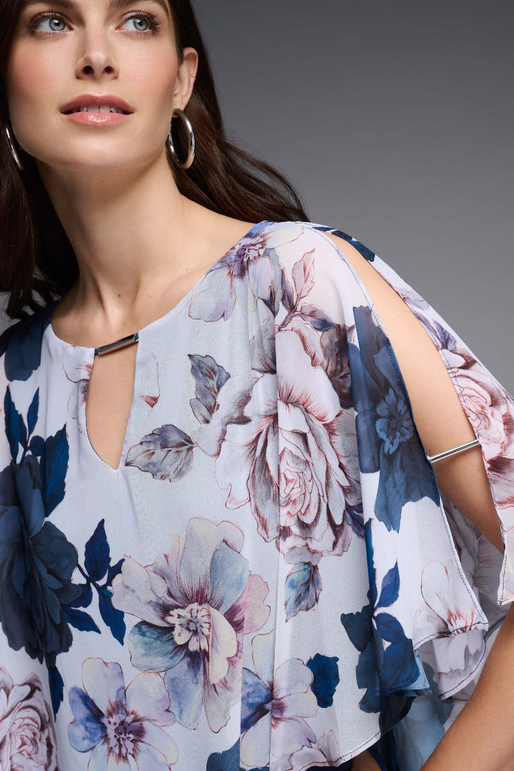 Feel like a walking piece of art in this Joseph Ribkoff Floral Chiffon Poncho Top. Carefully crafted from airy chiffon, cut for a flowing silhouette and decorated with a keyhole neckline makes this top feel as fabulous as it looks. Part the Joseph Ribkoff Signature Collection.