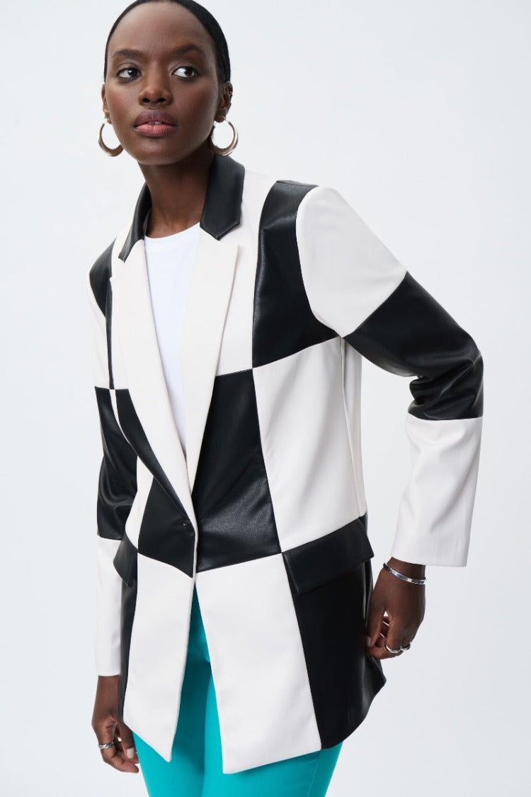 This gorgeous Joseph Ribkoff Checkered Blazer feels amazing in a soft faux leather. The striking black and white check design gives a pop of pizzazz for a modern daring style. Make it stand out with a colourful pant or a simple black or white.
