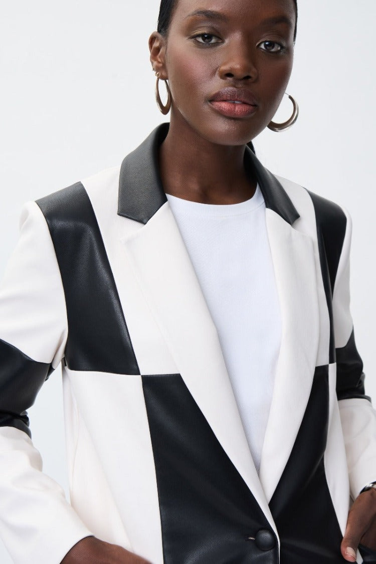 This gorgeous Joseph Ribkoff Checkered Blazer feels amazing in a soft faux leather. The striking black and white check design gives a pop of pizzazz for a modern daring style. Make it stand out with a colourful pant or a simple black or white.