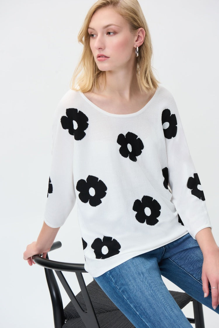 Bloom in style with this Joseph Ribkoff Flower Sweater. The lightweight floral sweater has a simple style that will enhance your wardrobe. This is a perfect way to light up your day when you style it with some favourite jeans or some fitted dress pants.