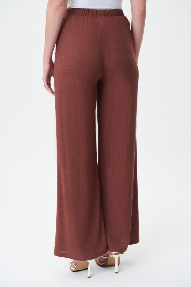 Joseph Ribkoff Wide Leg Pant  Style: 232105  Though these Joseph Ribkoff pants have a distinctly casual feel, they're very much a workplace-appropriate style, thanks to elegant wide leg cut and high-rise fit. Beautiful with anything, but especially paired with a blouse, tee, or camisole.  97% Viscose Rayon 3% Spandex. For best fit please refer to this size guide.