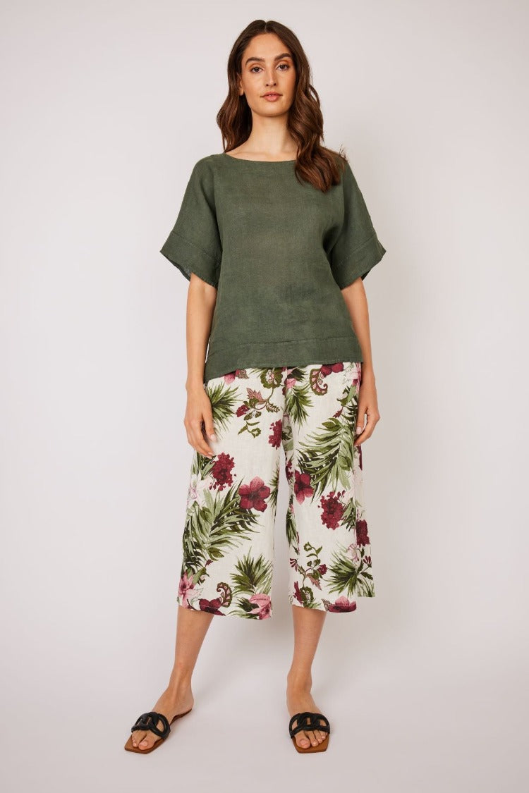 Pistache Cropped Linen Pant  This beautiful floral print on the Pistache Cropped Linen Pant is a bright addition to your wardrobe. The cropped linen is perfect for the heat of a summer vacation or adding colour to your day. 