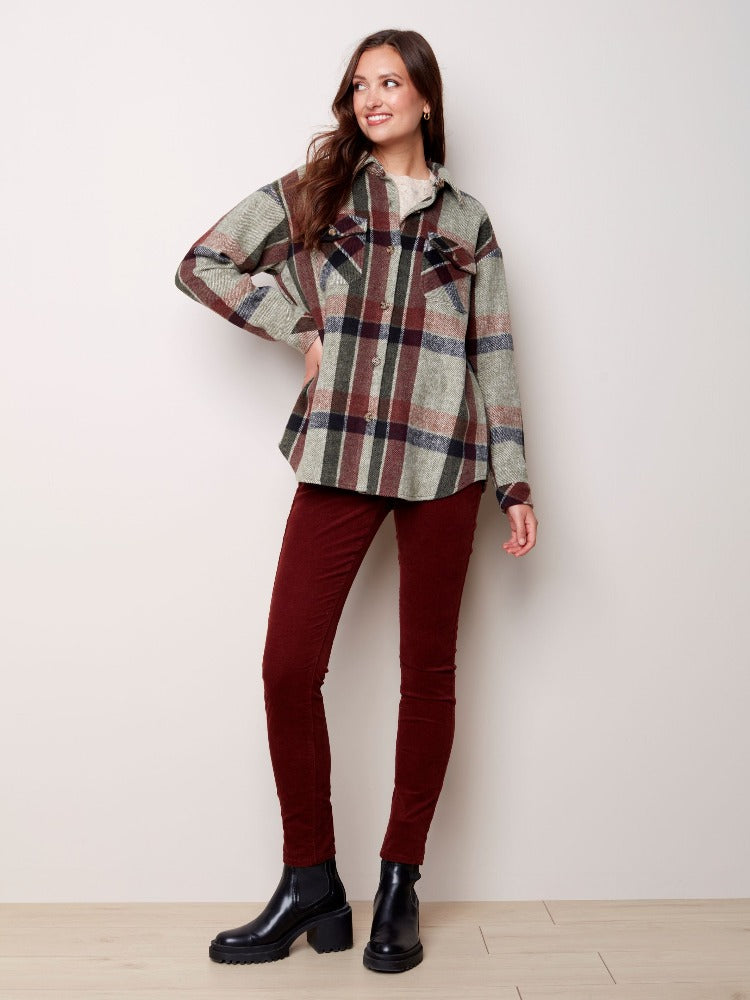 The love of plaid is strong with this Charlie B Flannel Shirt Jacket. The fabulous plaid in  a classic shirt look with its pointed collar, button front, shirttail hem and chest flap pockets, but like a trusted jacket it offers the warm comfort you desire for the season.