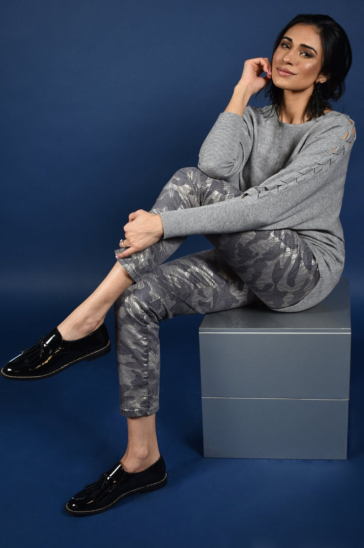 Frank Lyman Denim Camo Pant  Looking for a fresh look to start the season off right? Check out these shimmery Denim Camo Pants from Frank Lyman! These feature the classic, 5-pocket design and zip front with a fun, sparkly camo print. Proudly designed in Canada.