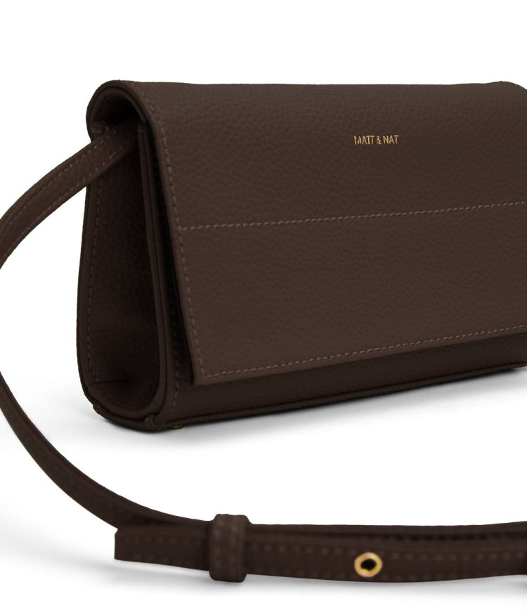 Matt & Nat EMI Vegan Purity Crossbody bag has wallet features and comes with an adjustable detachable strap and metal feet at the base.  You can use this cute bag as a clutch for a simple change of style.