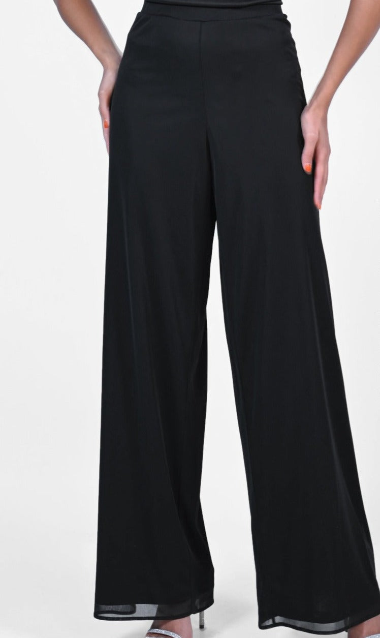 These lined Frank Lyman Wide Leg Dress Pants are an elegant, lightweight choice for your next event. These feature a convenient elastic waistband, a breezy overlay as well as a chic, wide leg design. Proudly made in Canada.