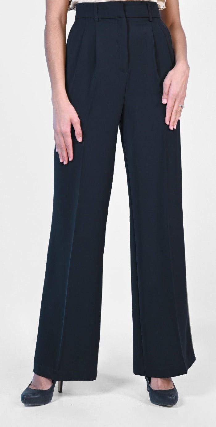 These high-rise, wide leg Woven Pleated Pants from Frank Lyman are great for the office or your next formal event. With classic front pleats, belt loops, a double front hook closure and zipper, angled side pockets, and faux back welt pockets, these pants are a chic choice.