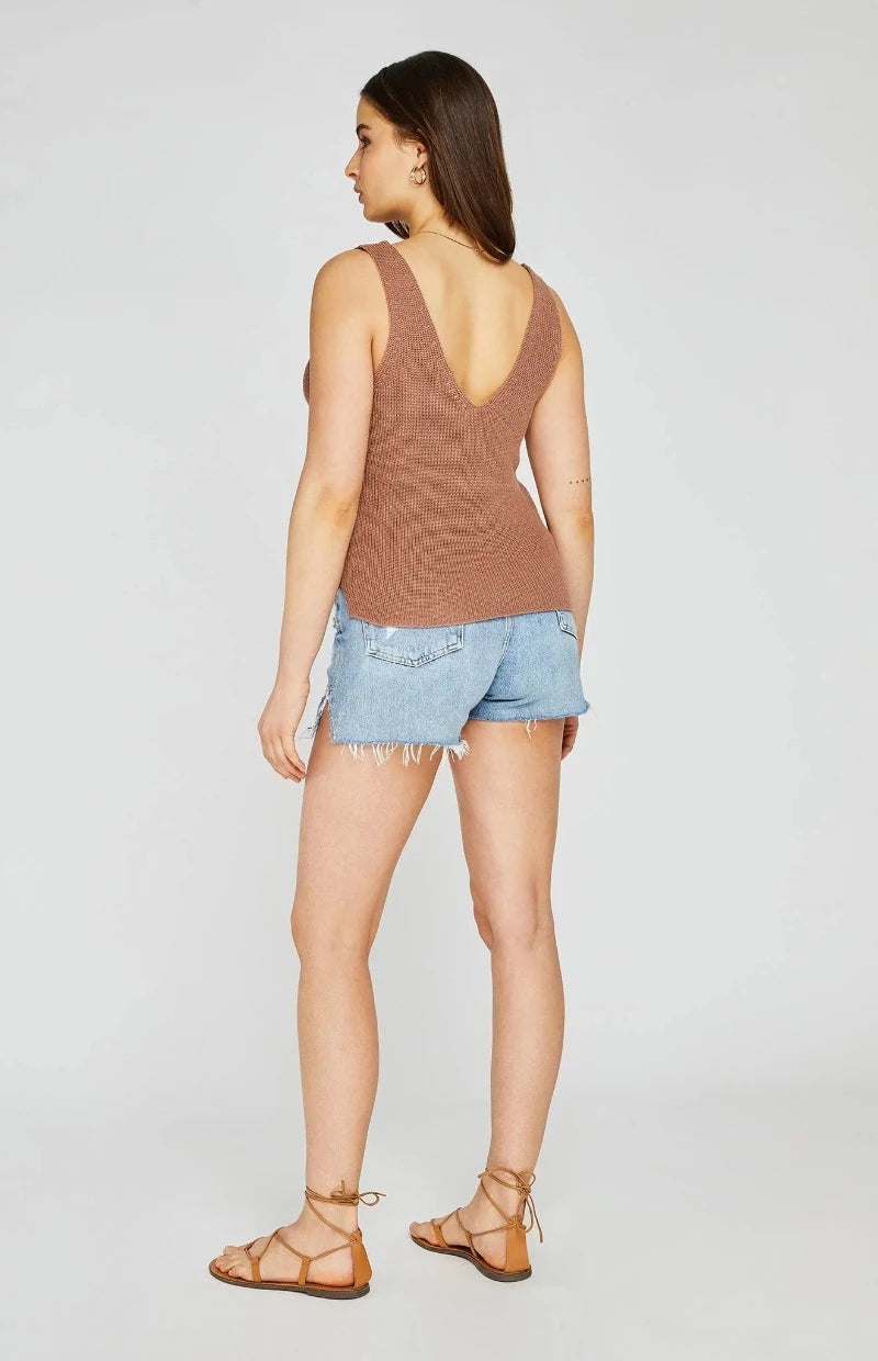 Gentle Fawn Lisette Tank  The Lisette tank is a Gentle Fawn classic. Features include a front and back v-neckline, side slits, and pointelle detailing. You will look great wearing this with a short or skirt and also have a lovely piece to layer under a blazer.
