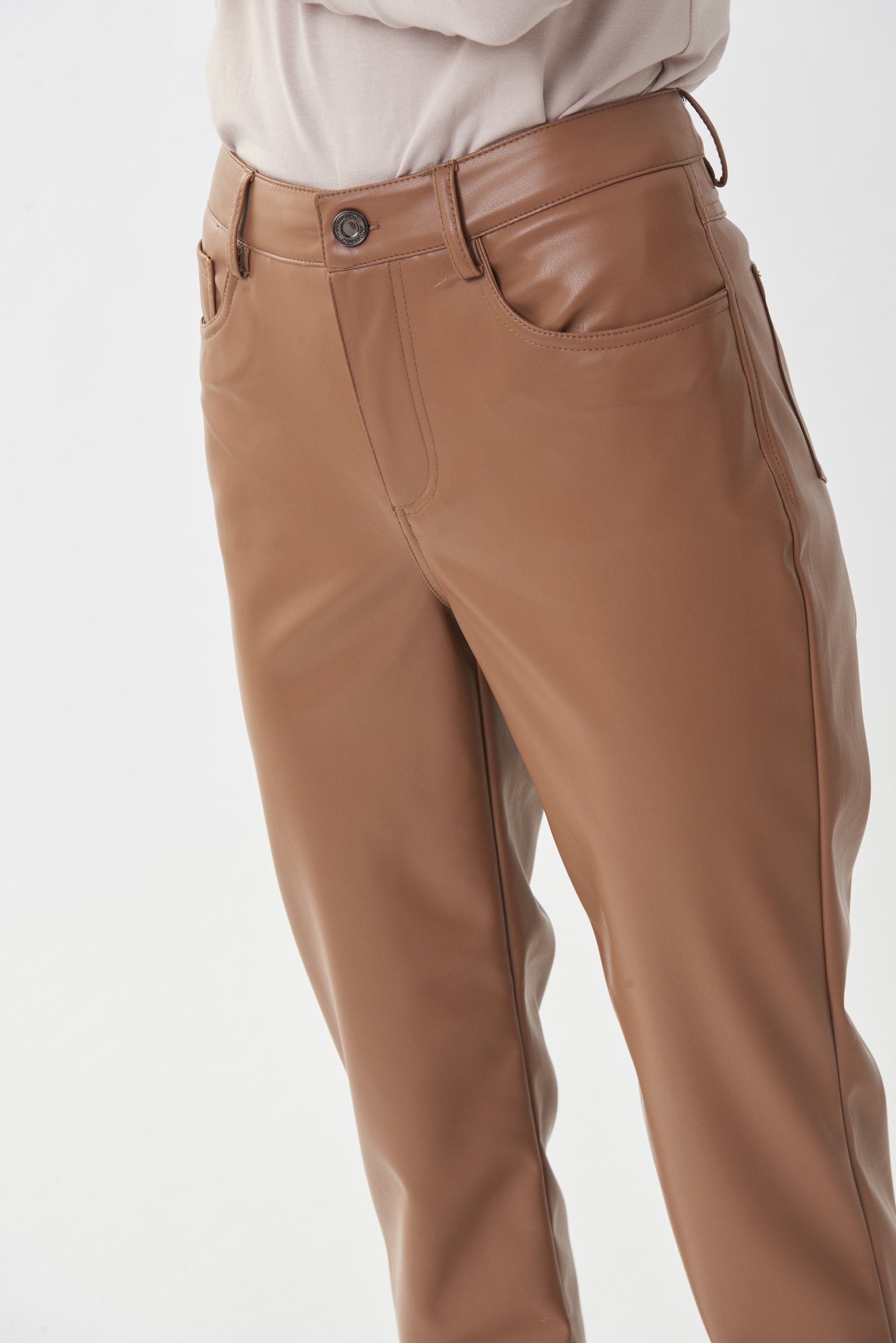 Make a stylish statement with these Pleather Pants from Joseph Ribkoff! These are cut in a denim-style design with belt loops, a button and zip fly, and fully functional front and back pockets. 