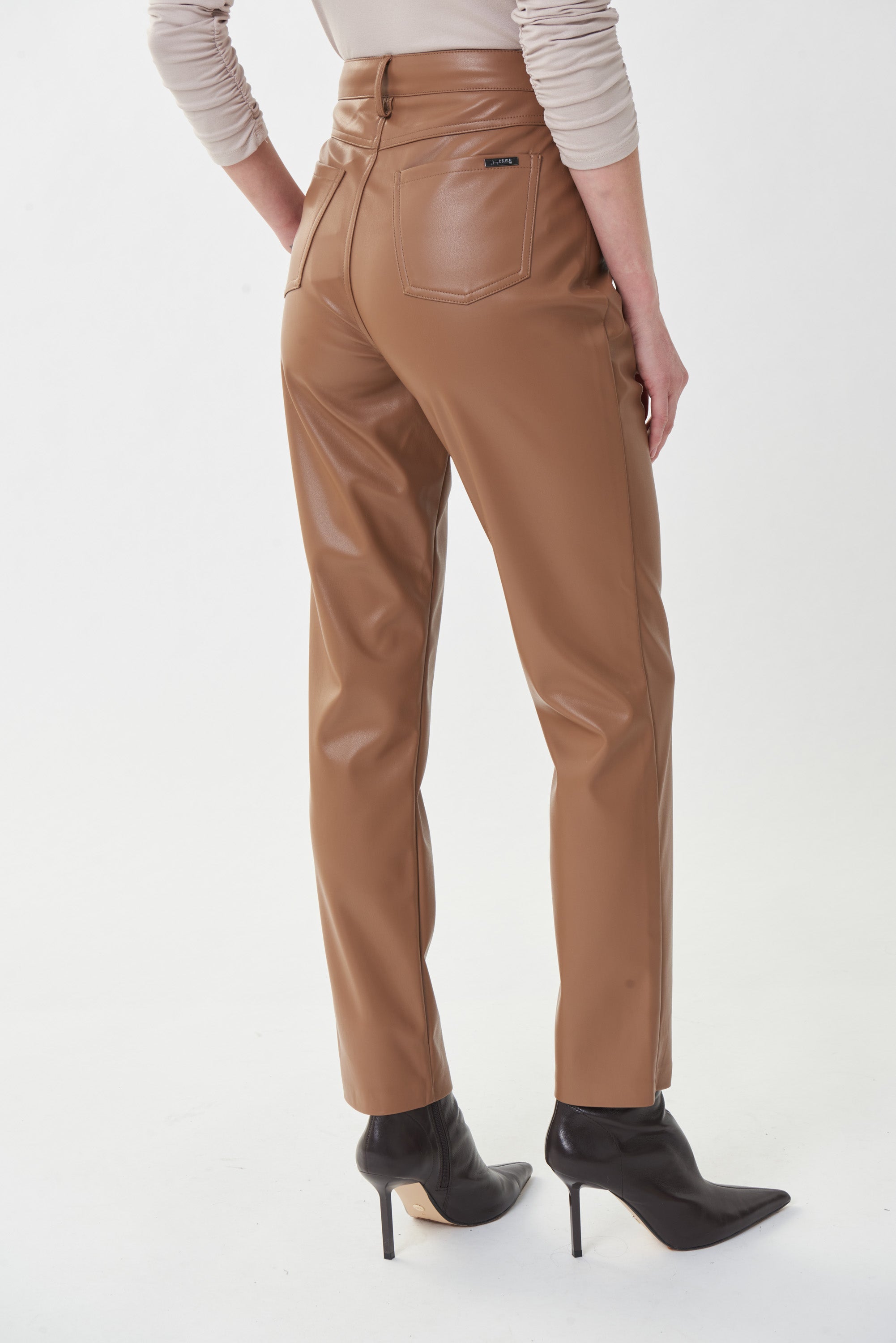 Make a stylish statement with these Pleather Pants from Joseph Ribkoff! These are cut in a denim-style design with belt loops, a button and zip fly, and fully functional front and back pockets. 