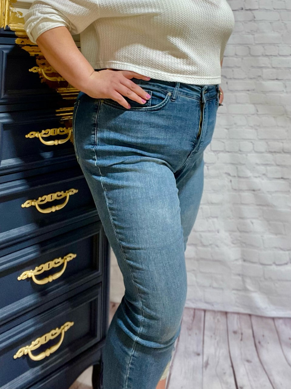 Judy Blue Plus High Waist Tummy Control Jeans  Slip into these Judy Blue Plus High Waist Tummy Control Jeans and show off those curves! These ultra flattering jeans feature a high waist tummy control top, 27" rise, a distressed hem and are finished with a classic medium indigo rinse. Also available in Regular Sizes.  Style: 88425 PL