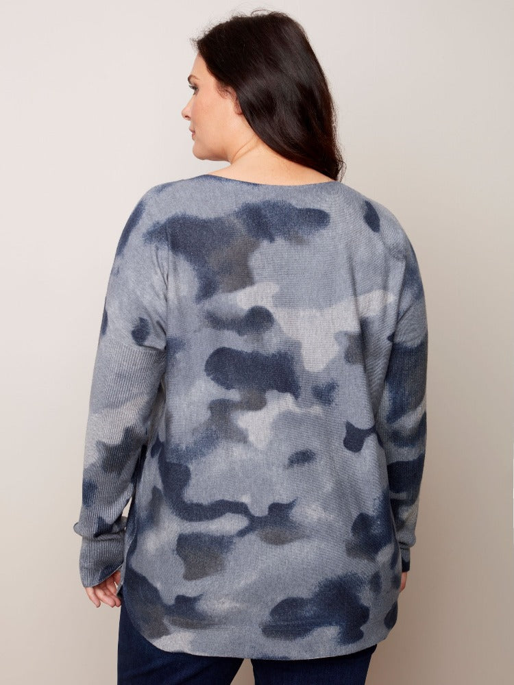 This tunic-length Charlie B Plus Long Sleeve Printed Sweater has so much for you to love.   Super comfy material, a rounded hem, ribbed sleeves as well as an eye-catching tie-dye print and it even has pockets! 