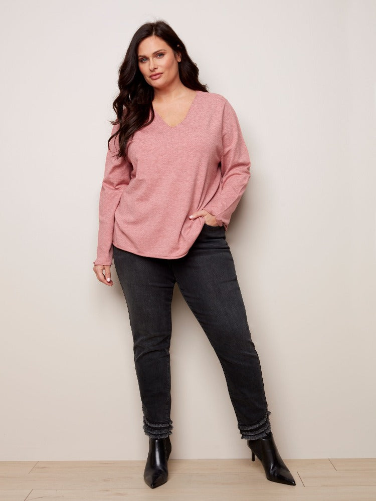 Your look will be anything but basic with this Charlie B Plus Basic V-Neck Sweater! From your best skinny jeans to business slacks you can wear it with just about anything.  Thanks to its soft, plushy yarn, the flattering V neck and versatility, it is sure to become one of your favourites.  