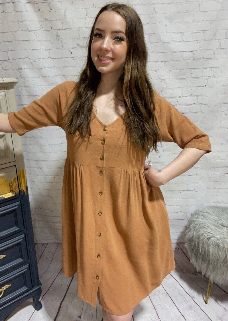 Jackson Rowe Outlaw Dress  The Jackson Rowe Outlaw Dress was made with an intentional oversized fit. This babydoll-inspired dress features an empire waist and tortoiseshell buttons, so you will look great on the patio for drinks or at the next barbeque. 
