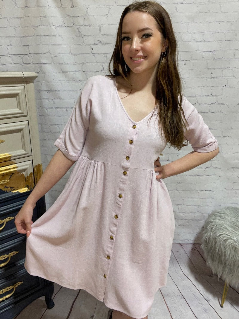 Jackson Rowe Outlaw Dress  The Jackson Rowe Outlaw Dress was made with an intentional oversized fit. This babydoll-inspired dress features an empire waist and tortoiseshell buttons, so you will look great on the patio for drinks or at the next barbeque. 