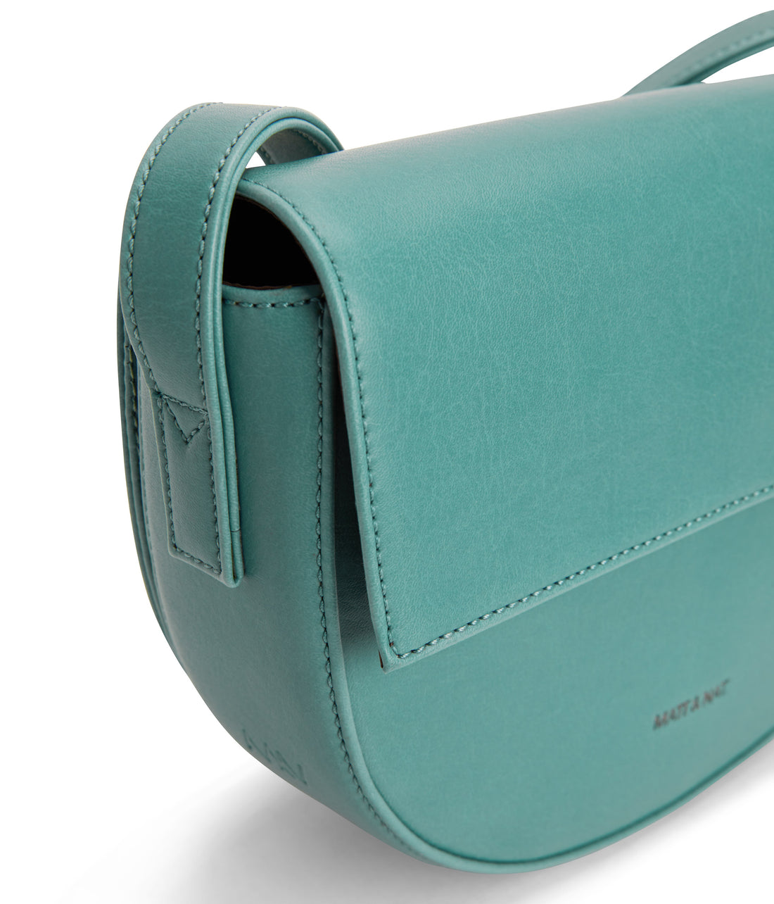Saddle bag with adjustable strap, flap with magnetic snap closure at main compartment, and a back gusseted zipper compartment.