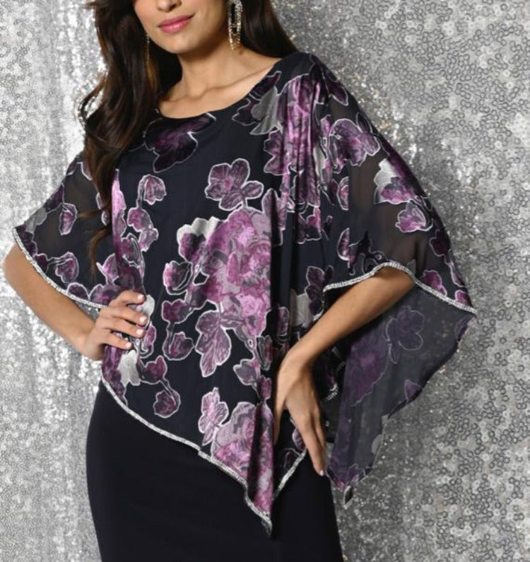﻿Frank Lyman Long Navy Purple Floral Dress ﻿  This Frank Lyman Long Navy Purple Floral Dress is a glamourous show stopper for your special event!  This stunning dress features a rounded neckline, sheer asymmetrical floral print overlay with rhinestone embellishments, over a floor lenght fitted dress with side slit.  
