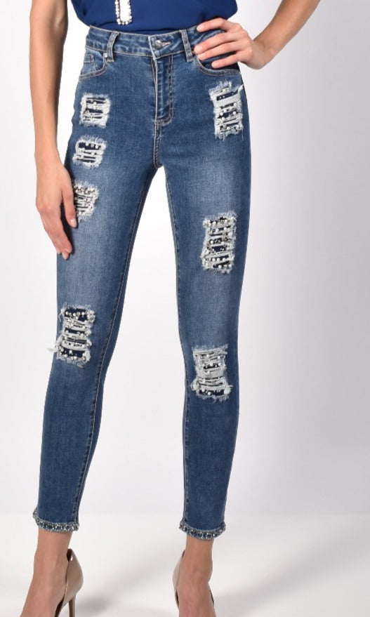Frank Lyman Pearl Beaded Pant  A bedazzled pair of jeans? Yes, please! These Frank Lyman Pearl Beaded Pants are a sophisticated step up from your traditional jeans, with distressed details, pearls, rhinestones and jeweled cuffs. Perfect for date night!